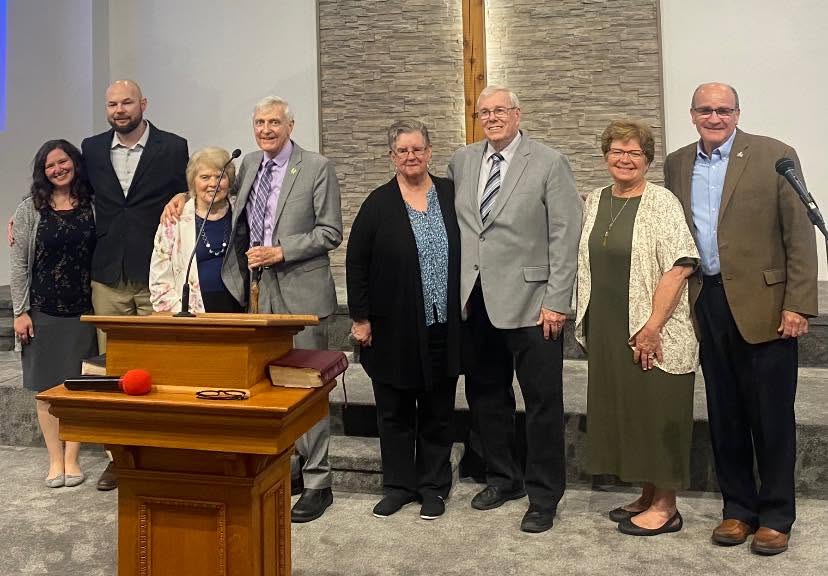 Group gathered beside the pulpit at Golden Harvest’s forty-fifth anniversary celebration.